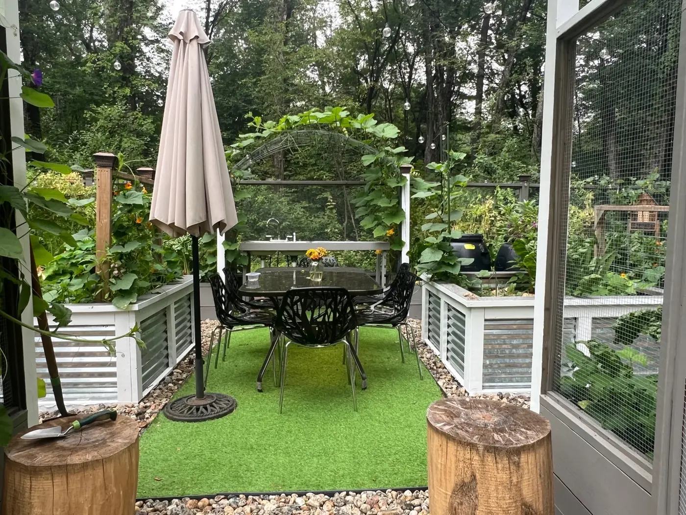 Garden entry opening toward a central dining table